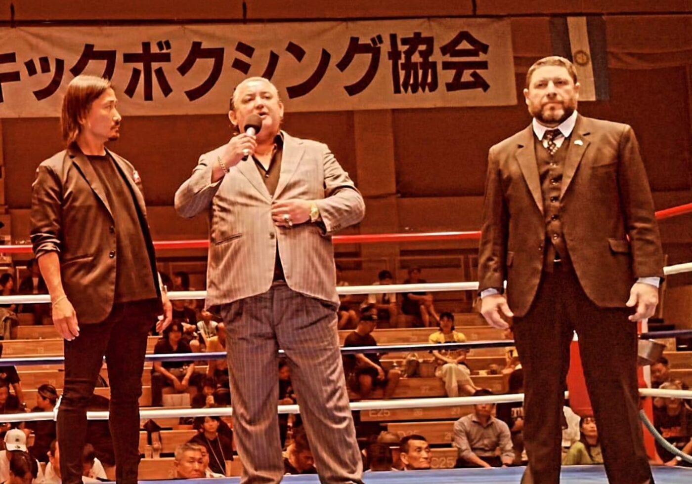 Chinto Mordillo addresses the crowd alongside Yu Kawakubo and Diego Gonzalez La Volpe at a Shin Nihon Kickboxing event in Japan